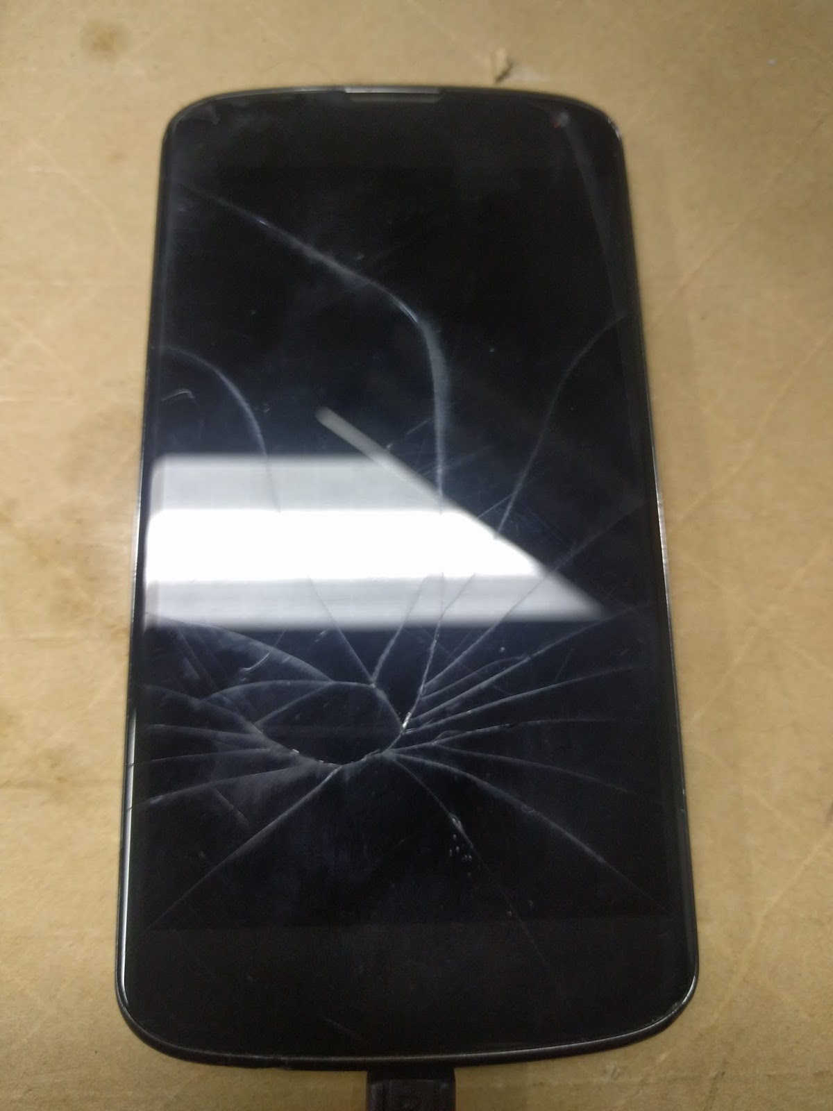 The Nexus 4 with a shattered screen.